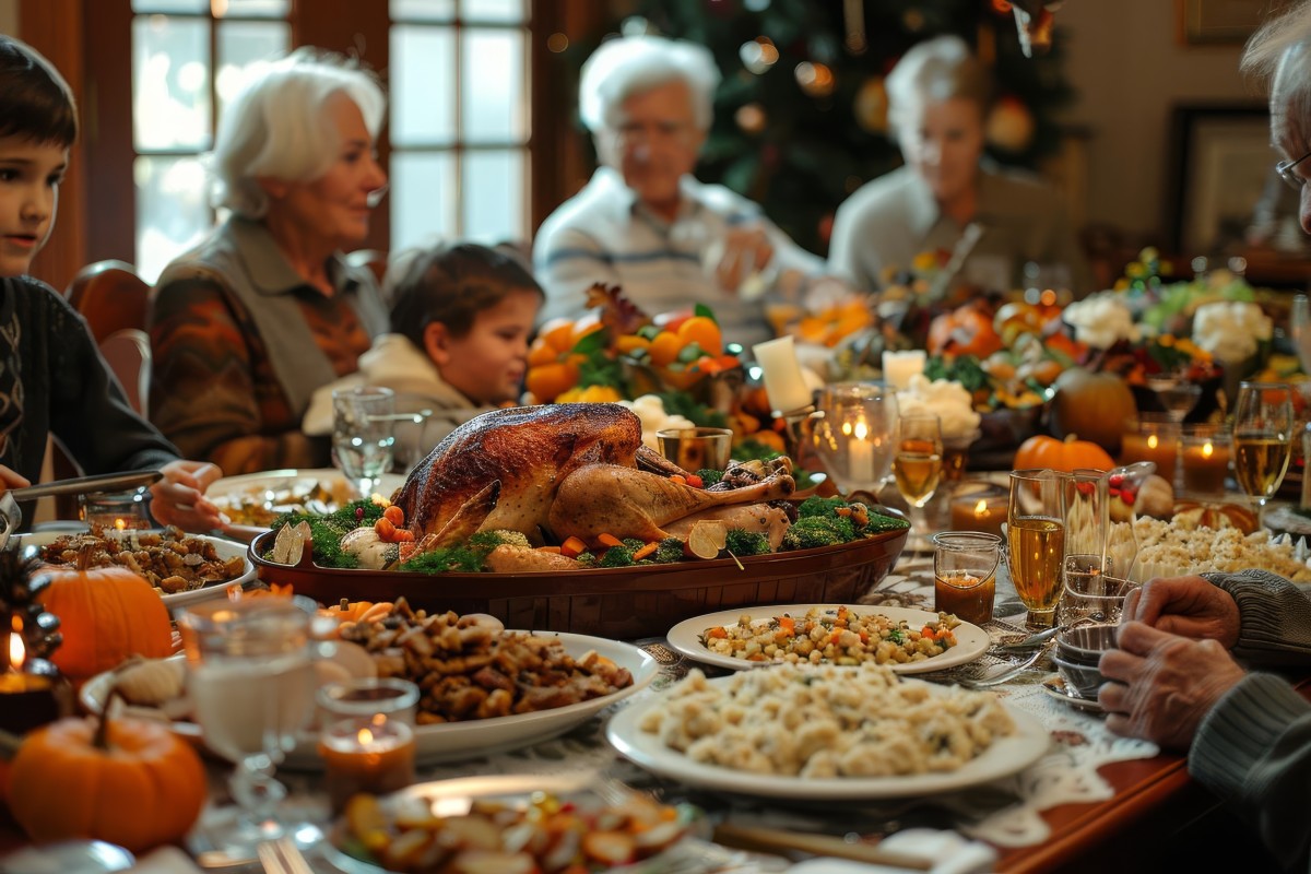 Family sitting around table with holiday dinner.